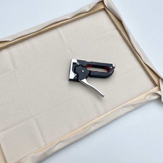 how-to-prepare-a-punch-needle-frame-step_10_halfway_staple.jpg?sw=554&q=85