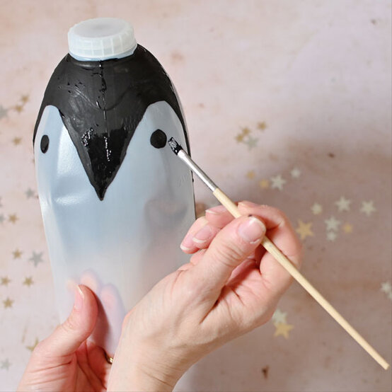how-to-make-winter-milk-bottle-lanterns_penguin-a.jpg?sw=554&q=85