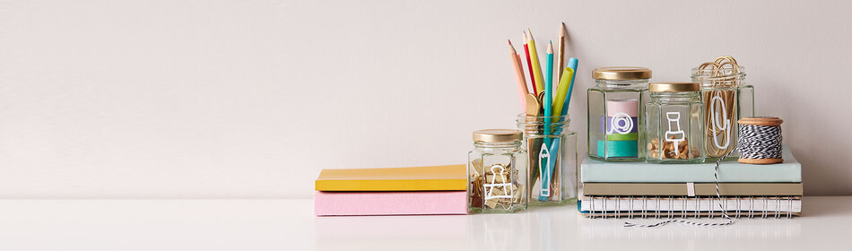 A desk filled with craft supplies