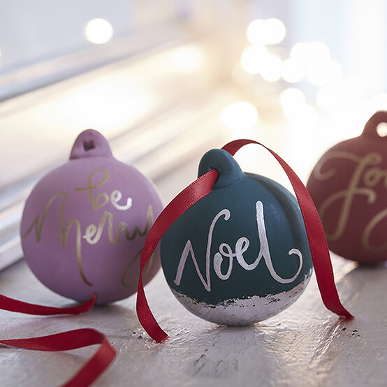 hanging-dec-ceramic-calligraphy-bauble-square.jpg?sw=554&q=85