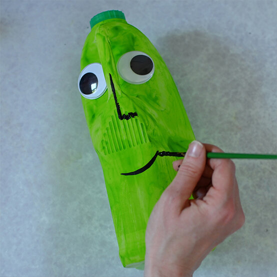 how-to-make-halloween-milk-bottle-lanterns_witch-a.jpg?sw=554&q=85