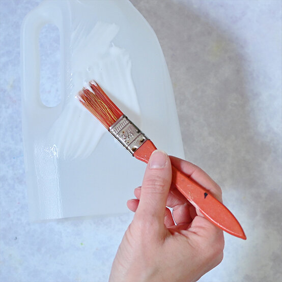 how-to-make-halloween-milk-bottle-lanterns_spiders-b.jpg?sw=554&q=85