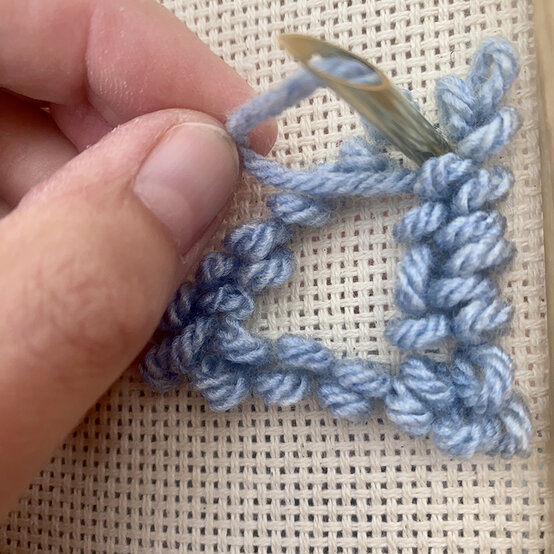how-to-make-punch-needle-winter-trees_step_5_last_stitch_in_section.jpg?sw=554&q=85