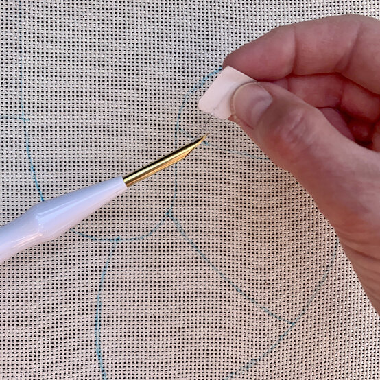 how-to-punch-needle-a-candy-cane-cushion_step_3a_threading_needle1.jpg?sw=554&q=85