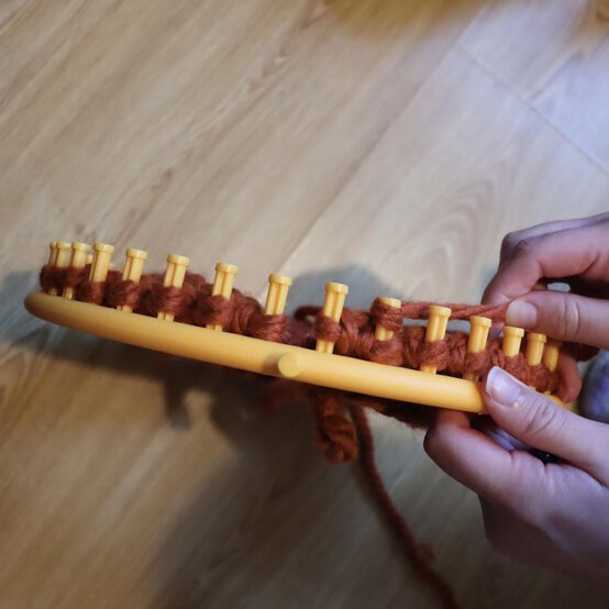 how_to_loom_knit_a_twisted_ear_warmer_step_8a.jpg?sw=554&q=85