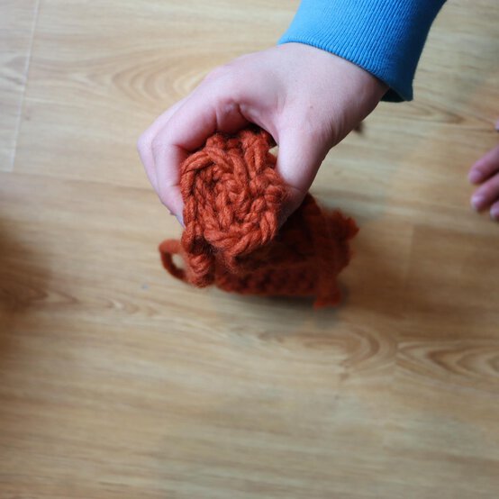 how_to_loom_knit_a_twisted_ear_warmer_step_9b.jpg?sw=554&q=85