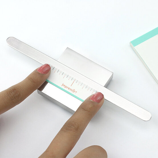 impressart-metal-stamping-cuff-1.jpg?sw=554&q=85