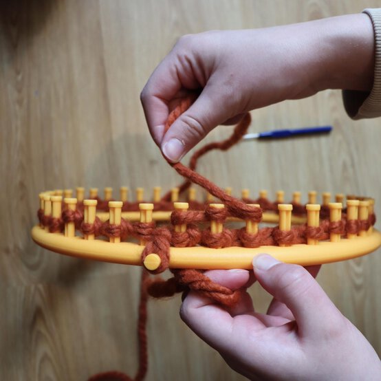 how_to_loom_knit_a_twisted_ear_warmer_step_5b.jpg?sw=554&q=85