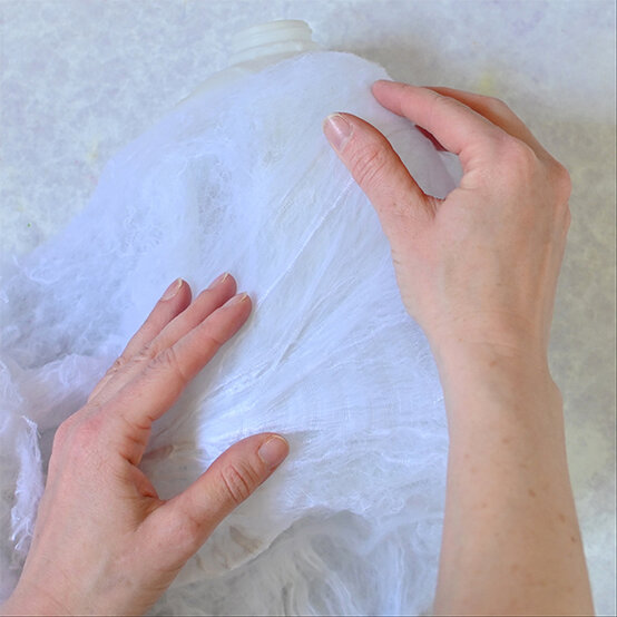 how-to-make-halloween-milk-bottle-lanterns_spiders-c.jpg?sw=554&q=85