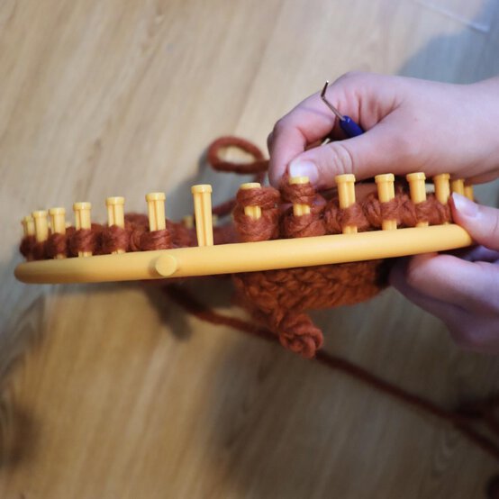 how_to_loom_knit_a_twisted_ear_warmer_step_8f.jpg?sw=554&q=85